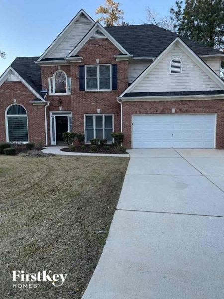 a brick house with a white garage door