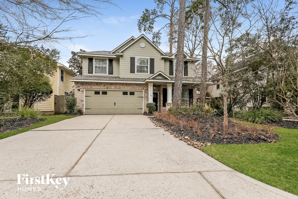 A house with a garage is for sale.