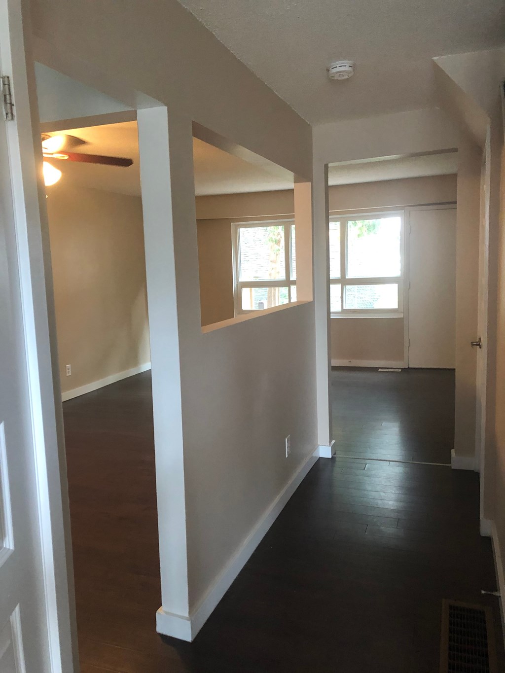 a view of a living room from the hallway of a house