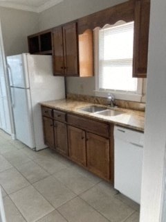 a kitchen with a sink and a refrigerator