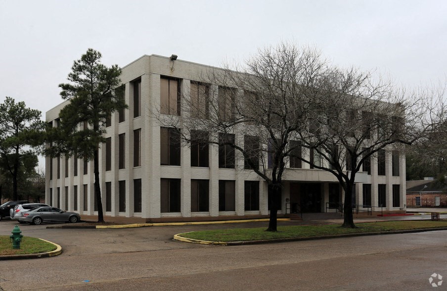 an office building on the corner of a city street