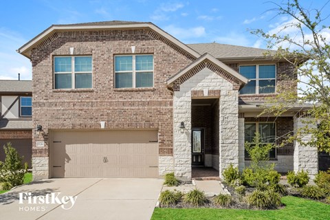a large brick house with a garage door