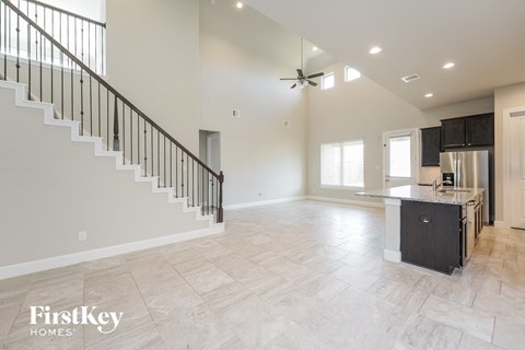 an open kitchen and living room in a new home