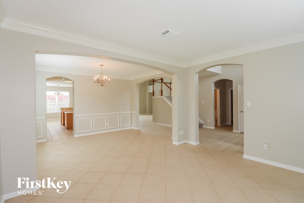 the living room and dining room are open to the kitchen and family room