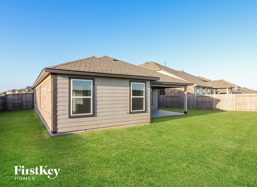 A house with a lawn in front of it.