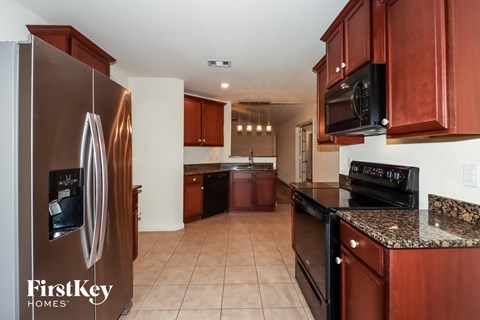 full view of the kitchen with wood cabinets and stainless steel appliances