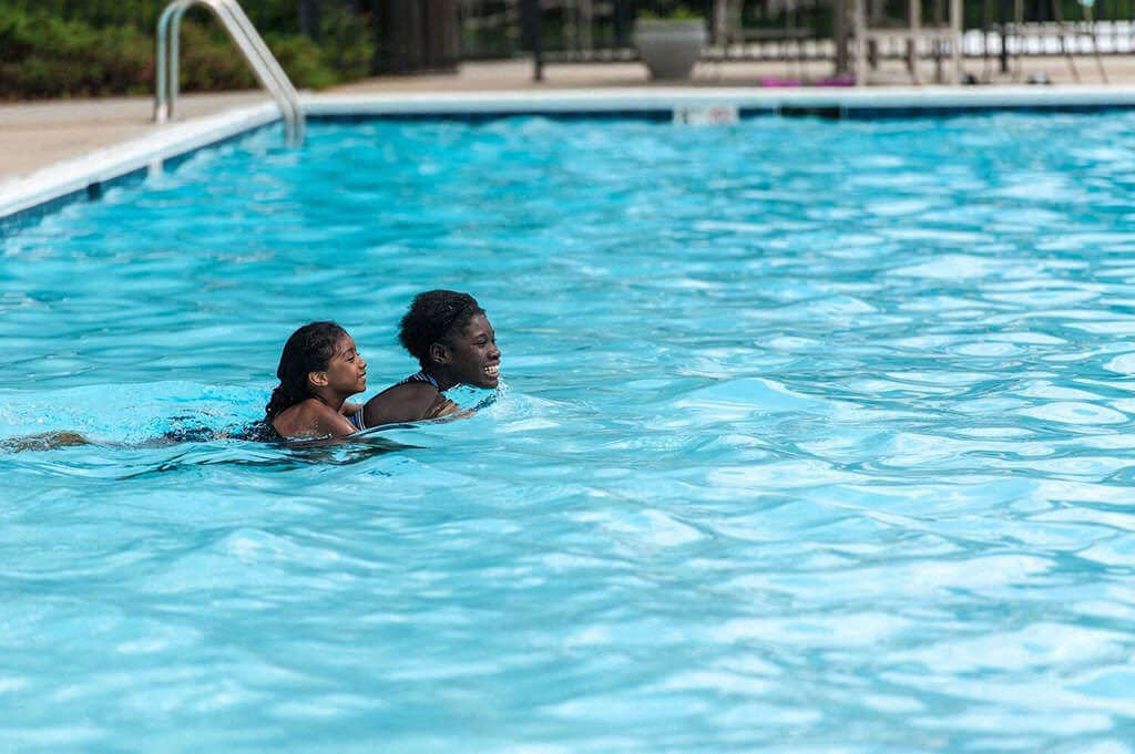 a man and a woman in a swimming pool