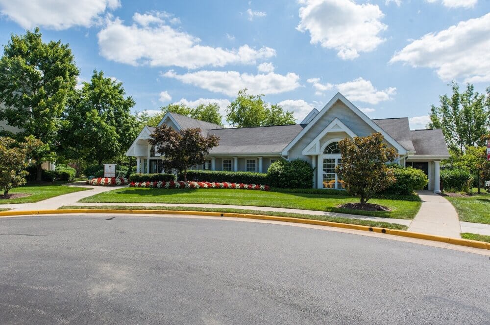 a house with a driveway and a street in front of it