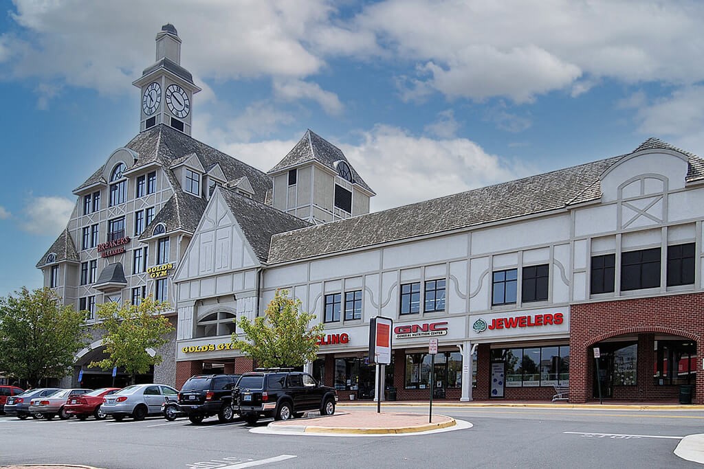 a building with a clock tower on top of it on a city street