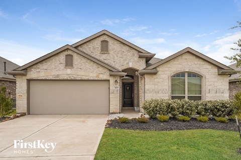 A house with a garage door that is numbered 311.