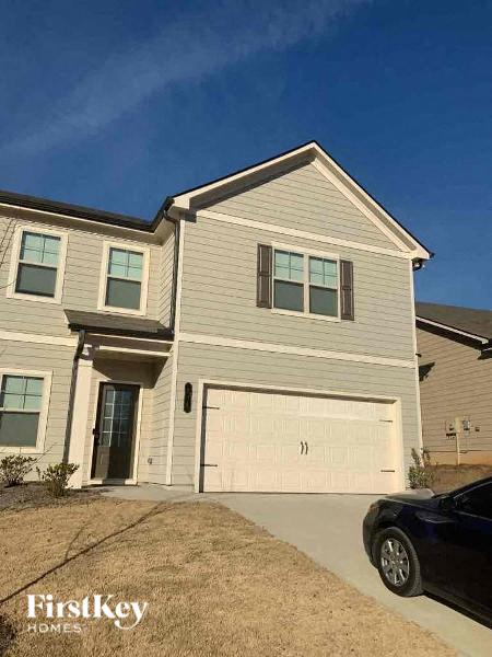 a white house with a white garage door