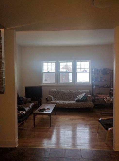 a living room with a couch and a table