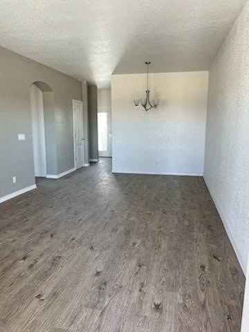 a empty living room with a wood floor