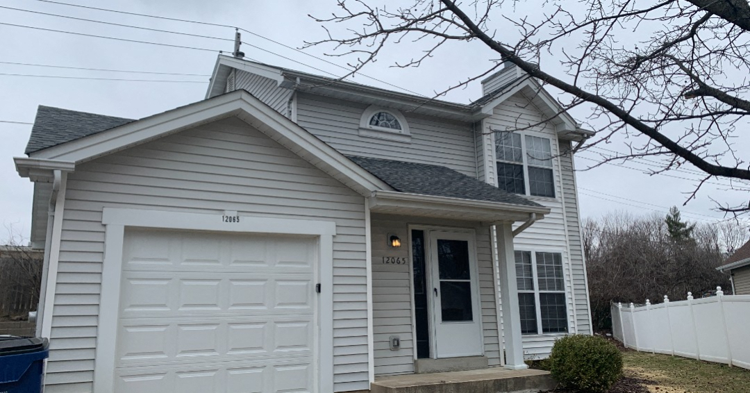 a white house with a white garage door