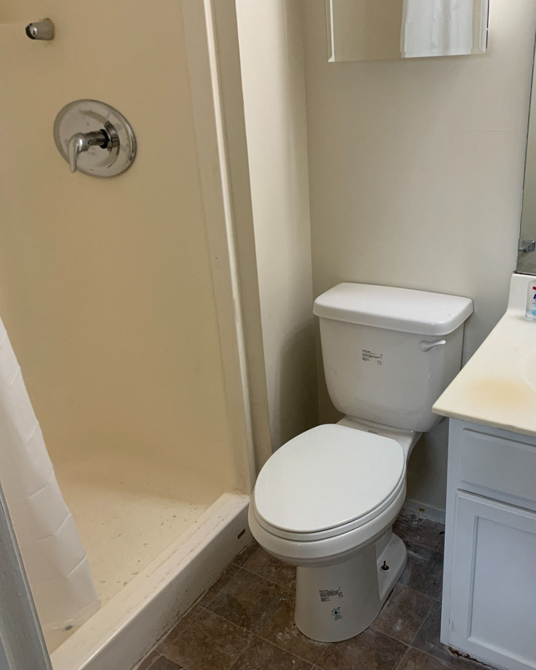 a small bathroom with a toilet and a shower