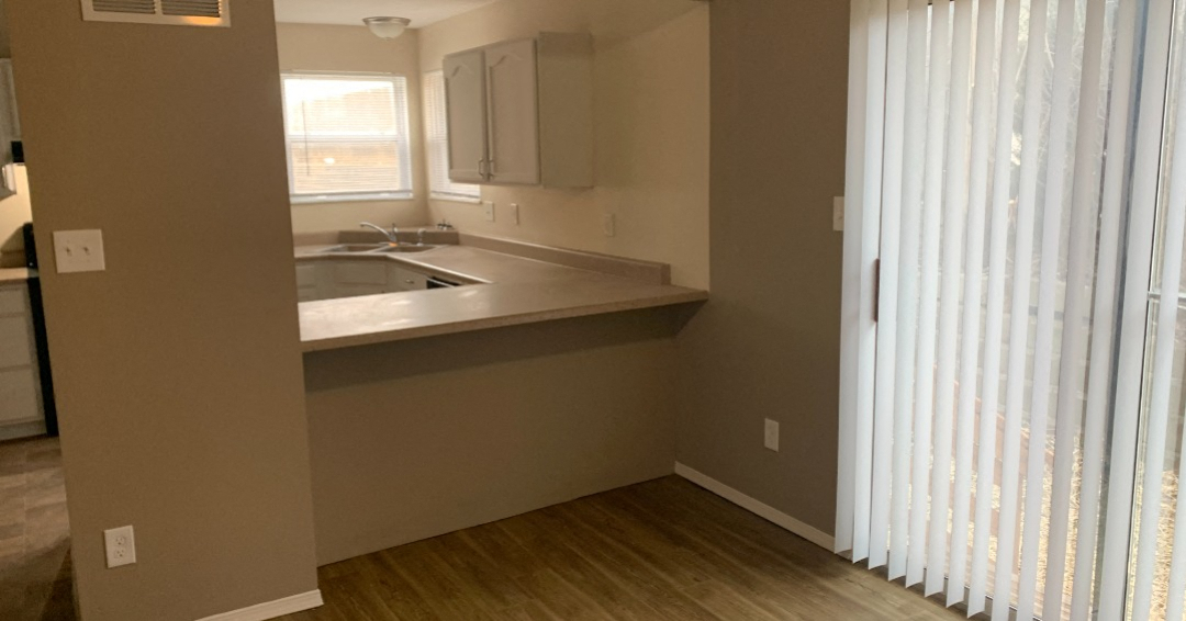 a kitchen with a sink and a window