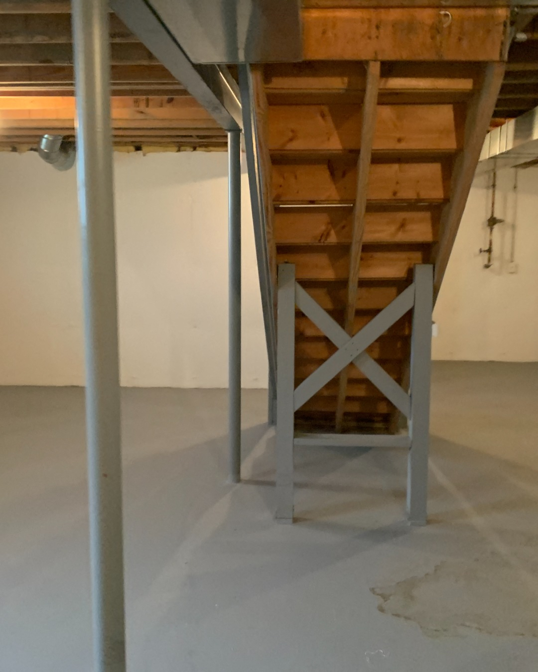 a view of a steel staircase in a basement