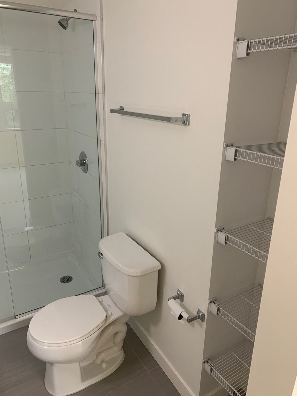 a small bathroom with a toilet and a shower