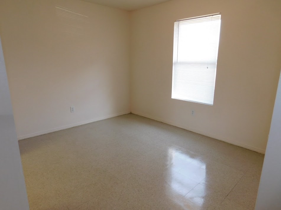 an empty room with a window in it