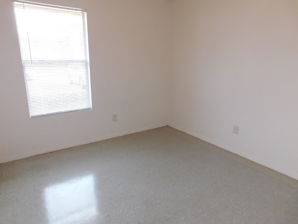 an empty room with a window in it