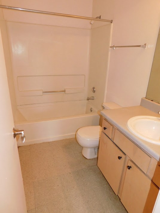 a bathroom with a toilet and a sink