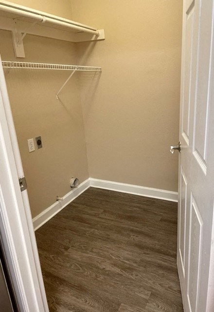 a empty room with a closet and a white door