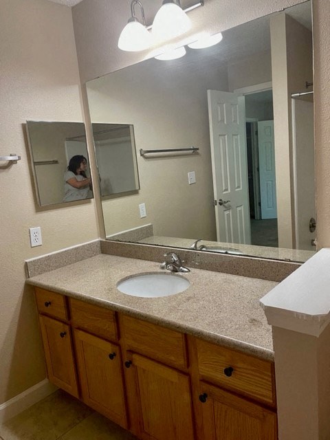 a bathroom with a sink and a mirror
