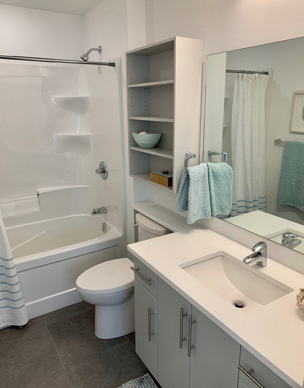 a bathroom with a sink toilet and a shower