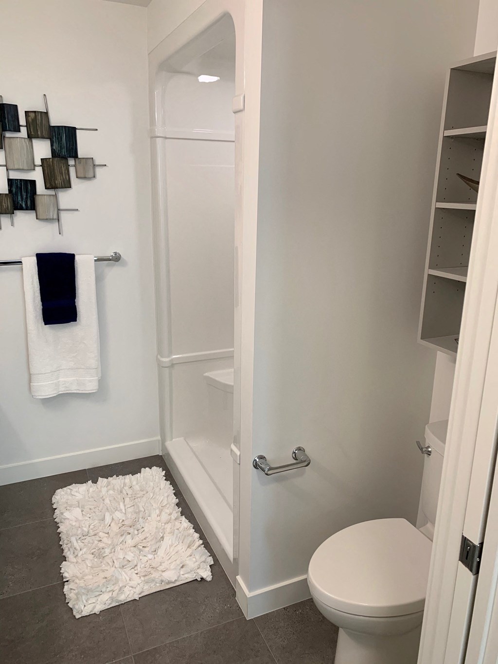 a small bathroom with a toilet and a shower