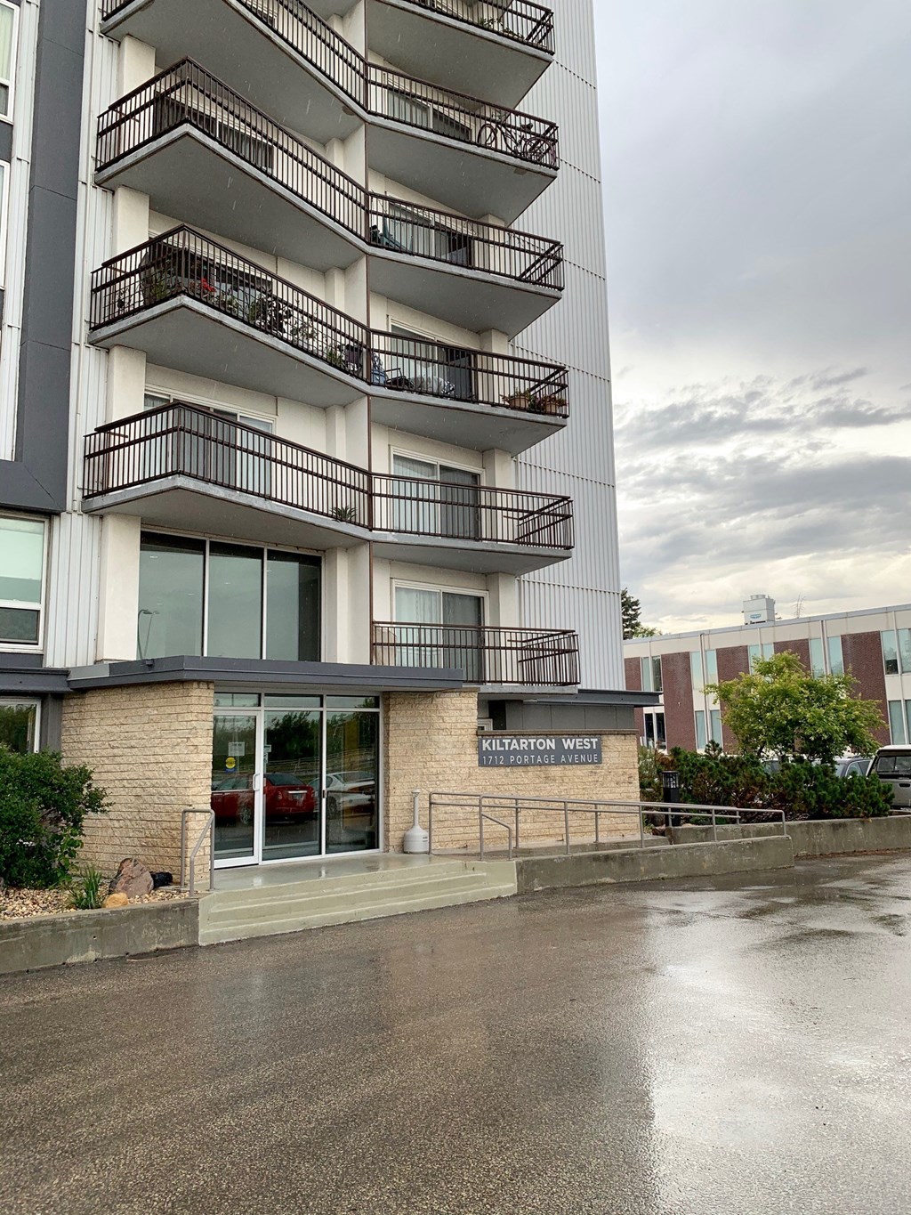 an apartment building on a rainy day in the rain