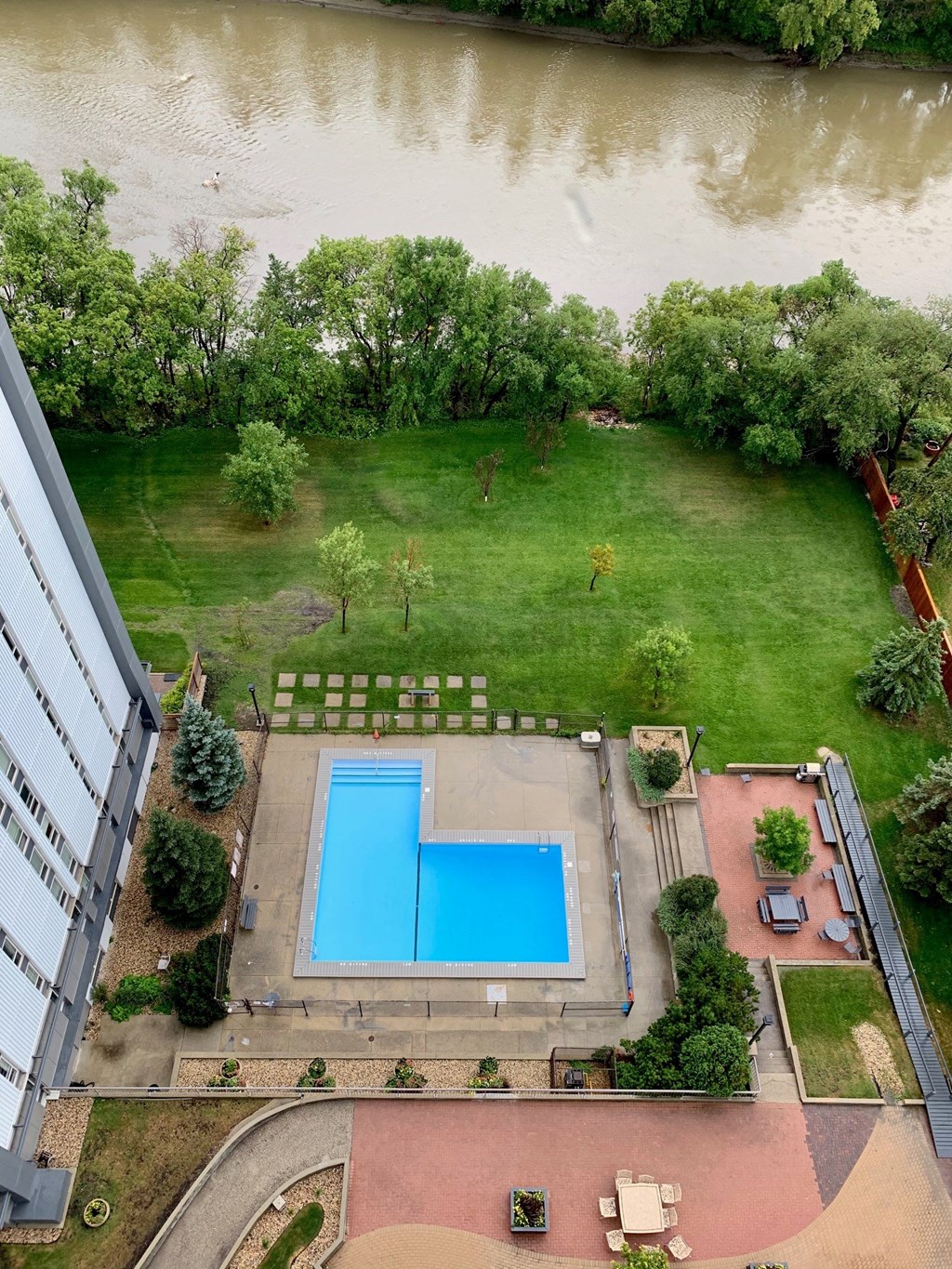 an aerial view of a swimming pool in the middle of a building