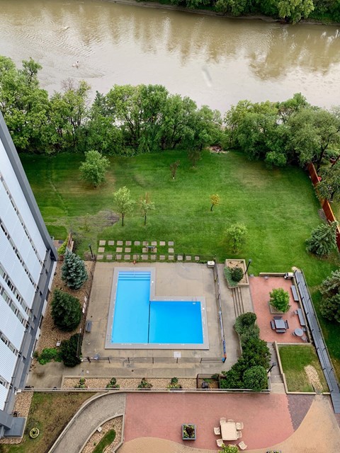 an aerial view of a swimming pool in the middle of a building