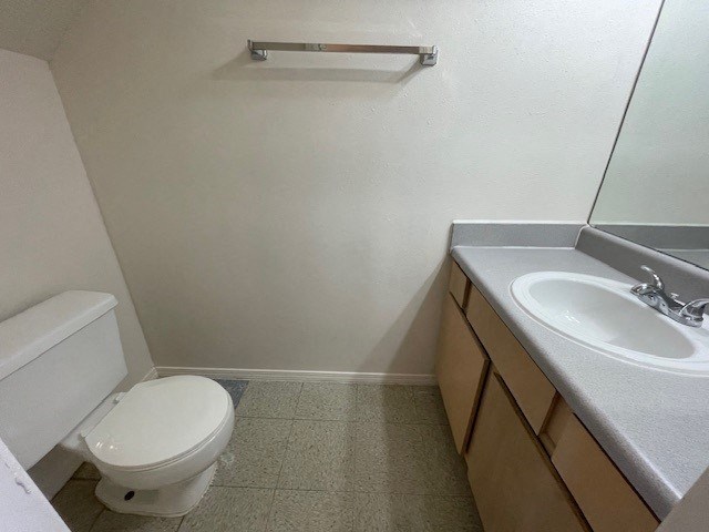 a bathroom with a toilet and a sink