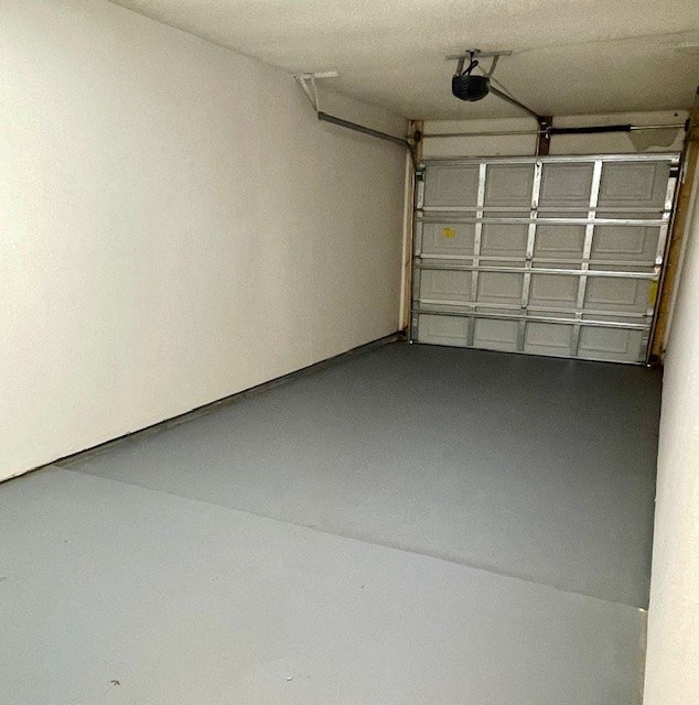 an empty room with a garage door in it