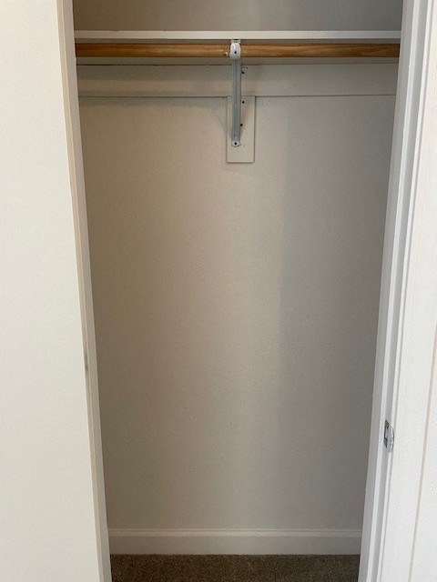 an empty closet with a white door
