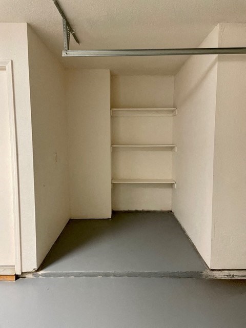 a small closet with empty shelves in it