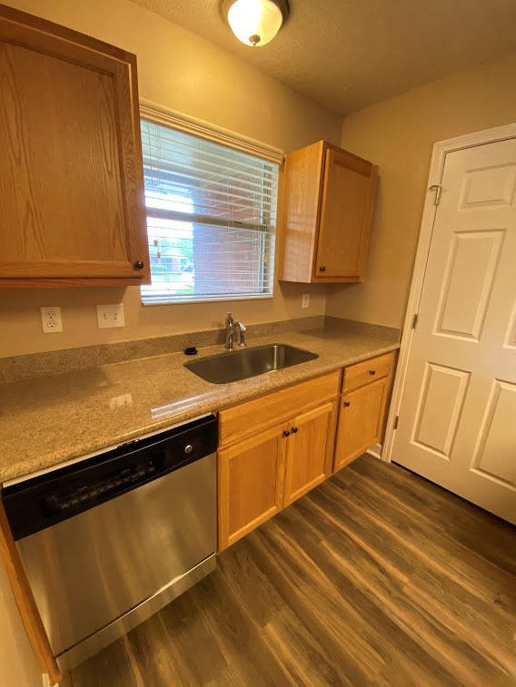 a kitchen with a sink and a door