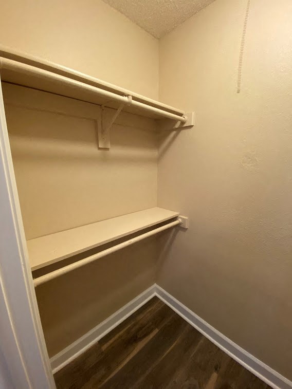 a empty closet with a shelf in it