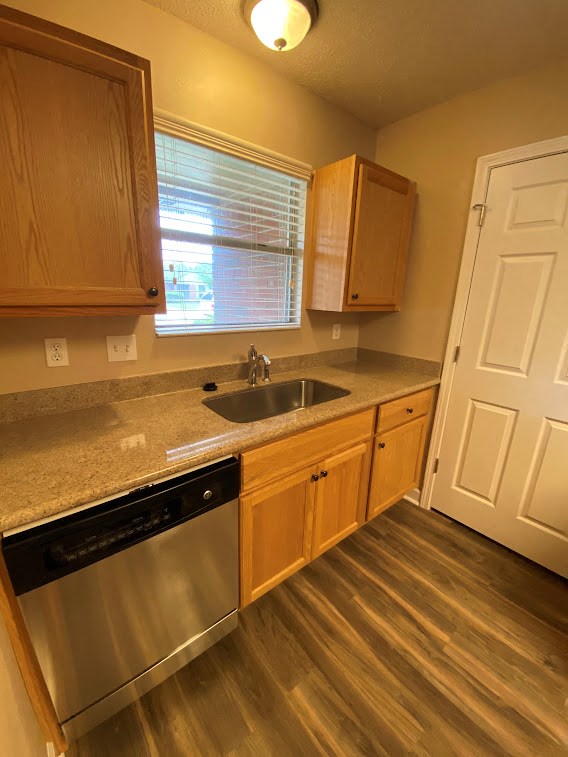 a kitchen with a sink and a door