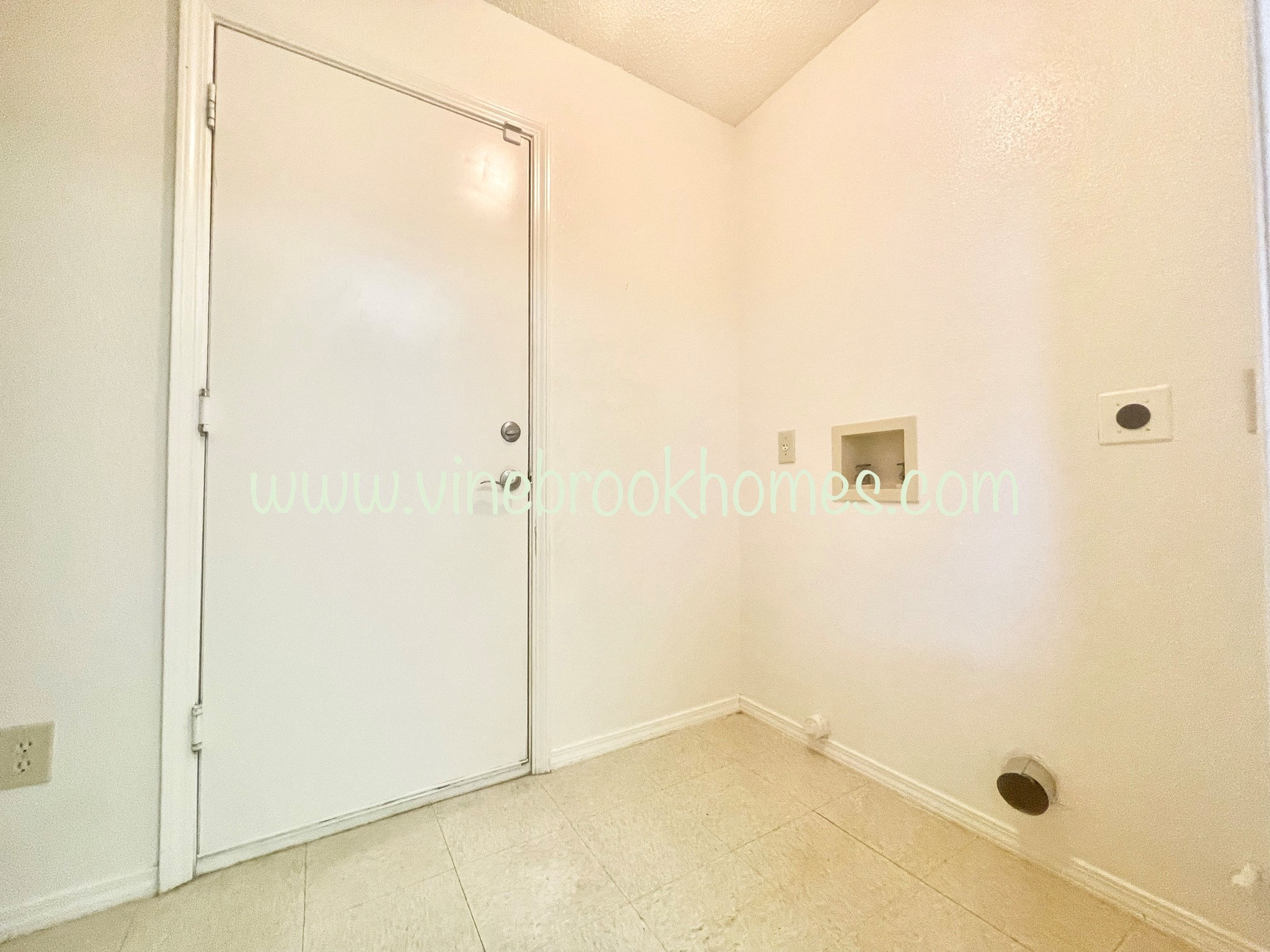 white bedroom with a closet and a door