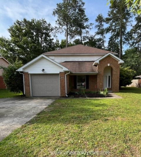 a house with a driveway and a garage door