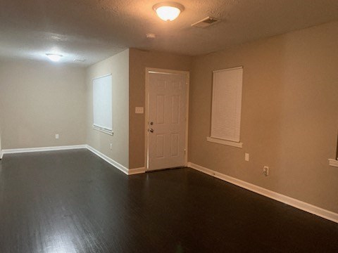 a empty living room with a white door