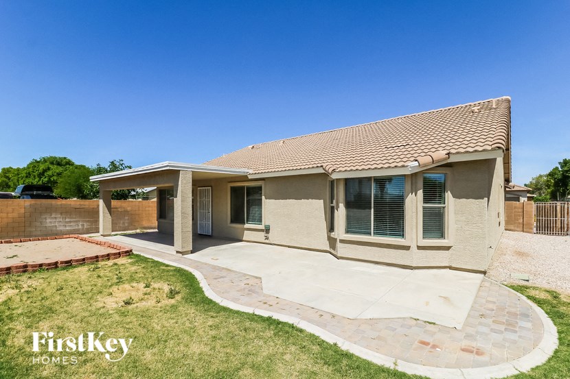 A house with a brick walkway in front of it.