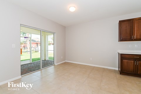 a living room with a sliding glass door to the yard