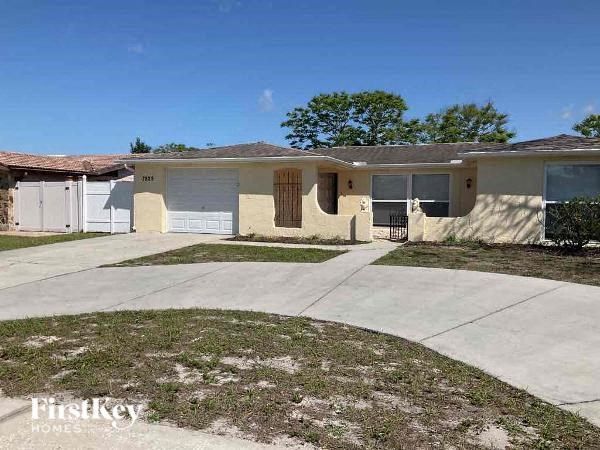 A row of houses with the words "FirstKey Homes" on the bottom left.