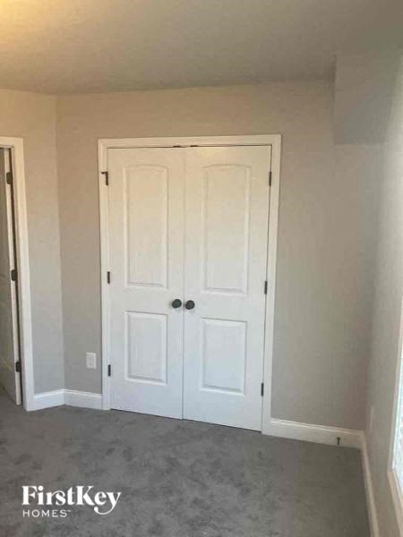a room with a closet and two doors