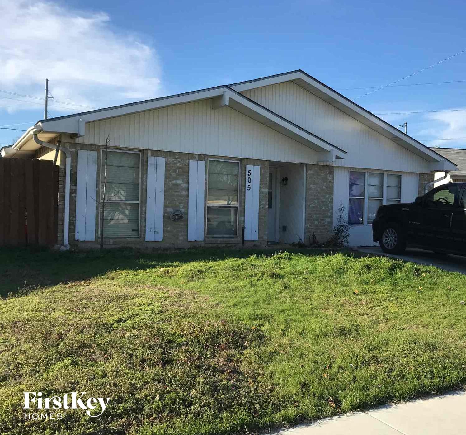 a house with a car parked in front of it