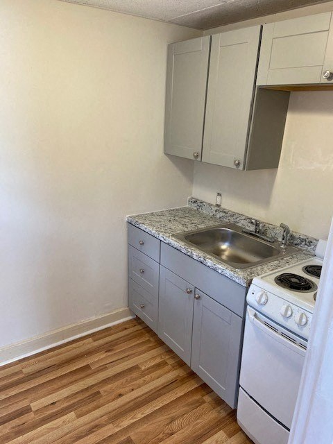 a small kitchen with a sink and a stove