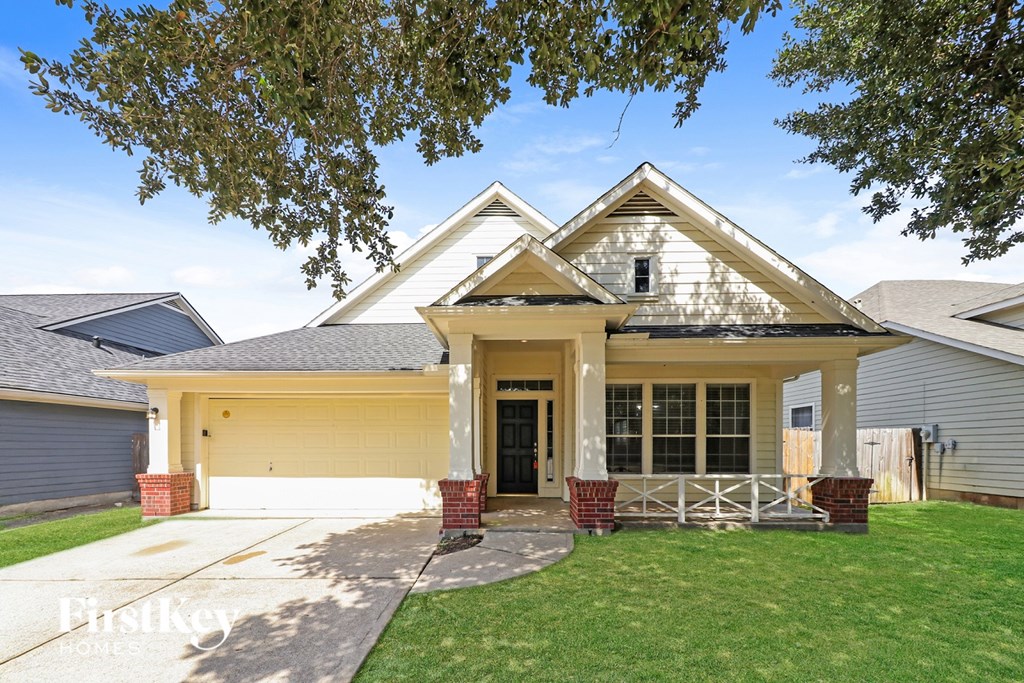 A house with a garage and a driveway.