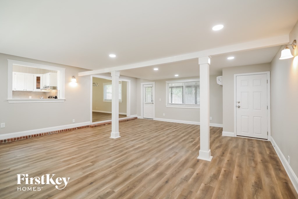 the living room and dining room are open to the kitchen
